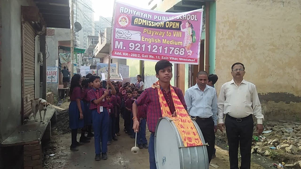 Students marching in a school admission awareness rally