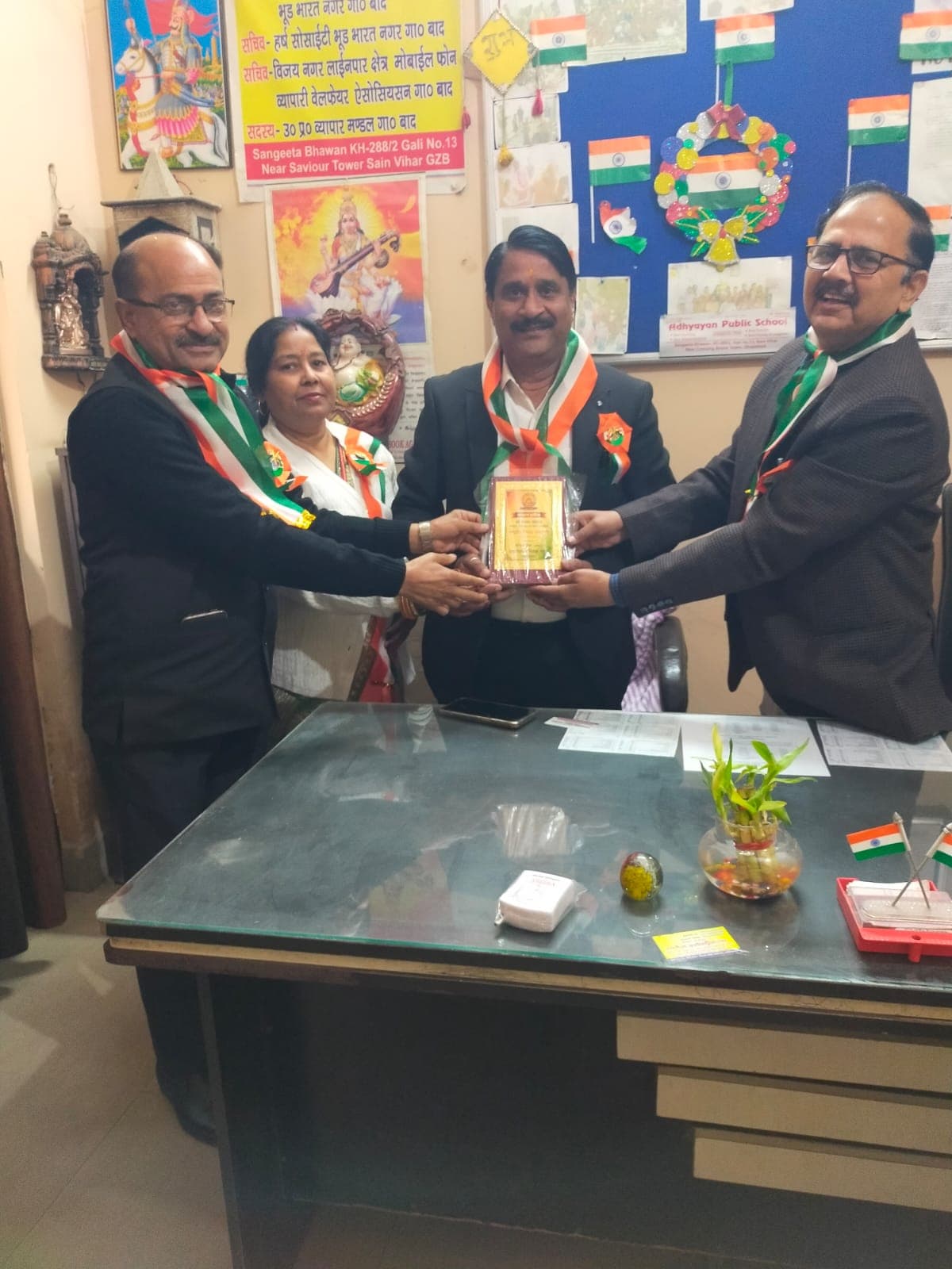 The school leadership team being felicitated with an award